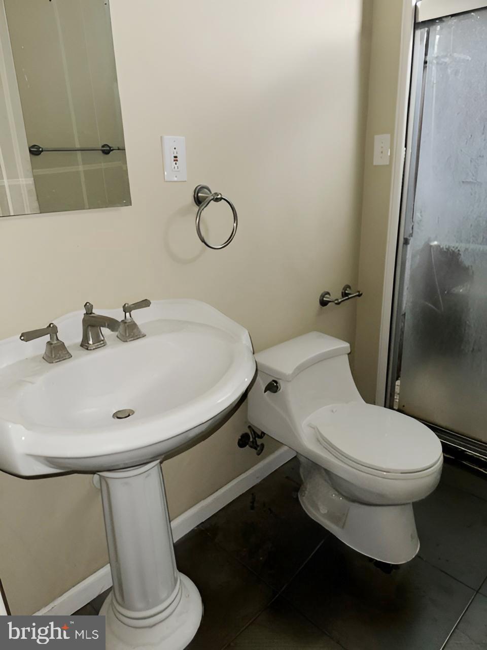 3 Morning Star Court Baltimore, MD 21206 - Photo 26 of 28 a white toilet sitting next to a bathroom sink