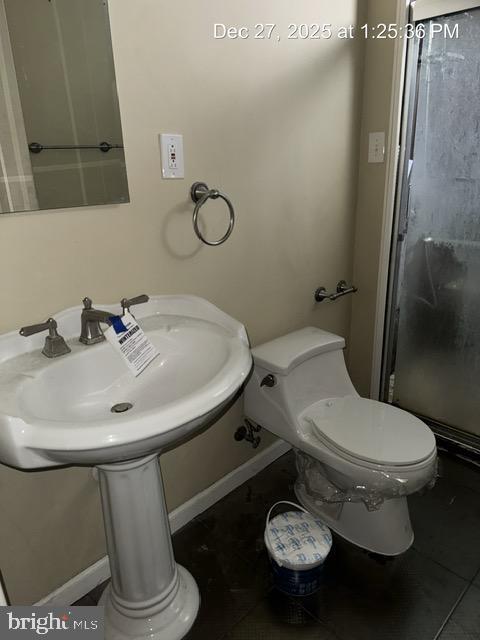 3 Morning Star Court Baltimore, MD 21206 - Photo 29 of 43 a white toilet sitting next to a bathroom sink
