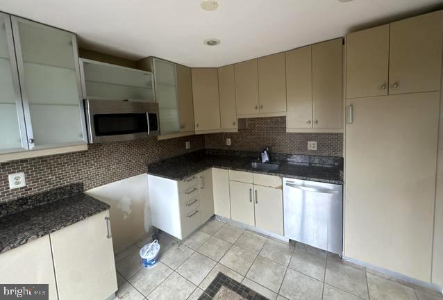 3 Morning Star Court Baltimore, MD 21206 - Photo 8 of 43 a kitchen with stainless steel appliances granite countertop a stove a sink and a white cabinets