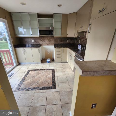 3 Morning Star Court Baltimore, MD 21206 - Photo 9 of 43 a kitchen with a sink and cabinets