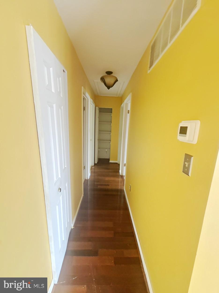 3 Morning Star Court Baltimore, MD 21206 - Photo 10 of 28 a view of a hallway with wooden floor and a bathroom