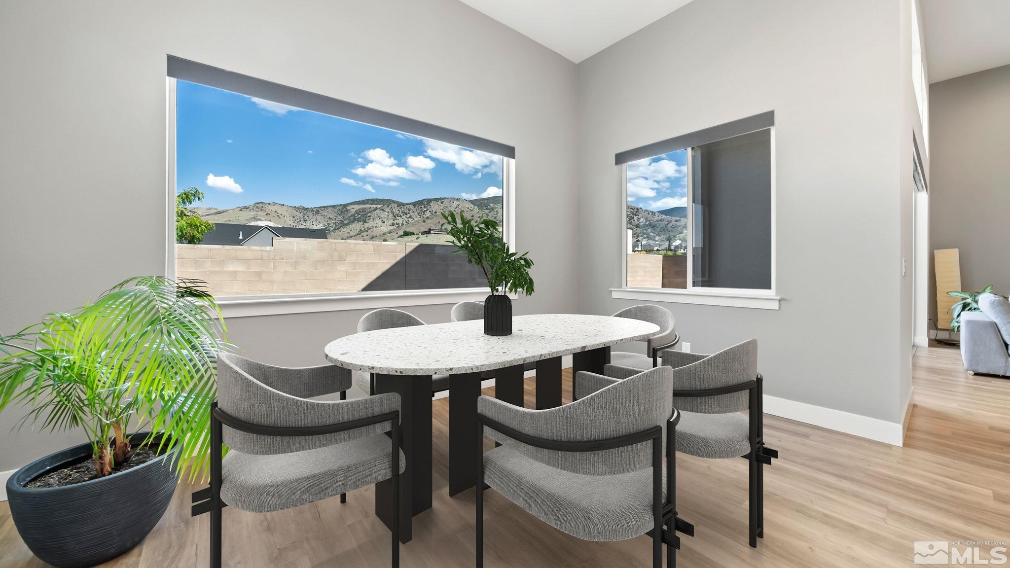 13550 Water Willow Street Reno, NV 89521 - Photo 15 of 37 a view of a dining room with furniture window and wooden floor