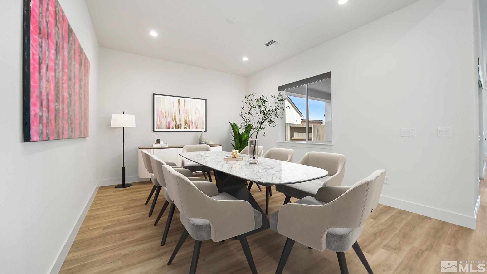 13550 Water Willow Street Reno, NV 89521 - Photo 19 of 37 a view of a dining room with furniture and wooden floor