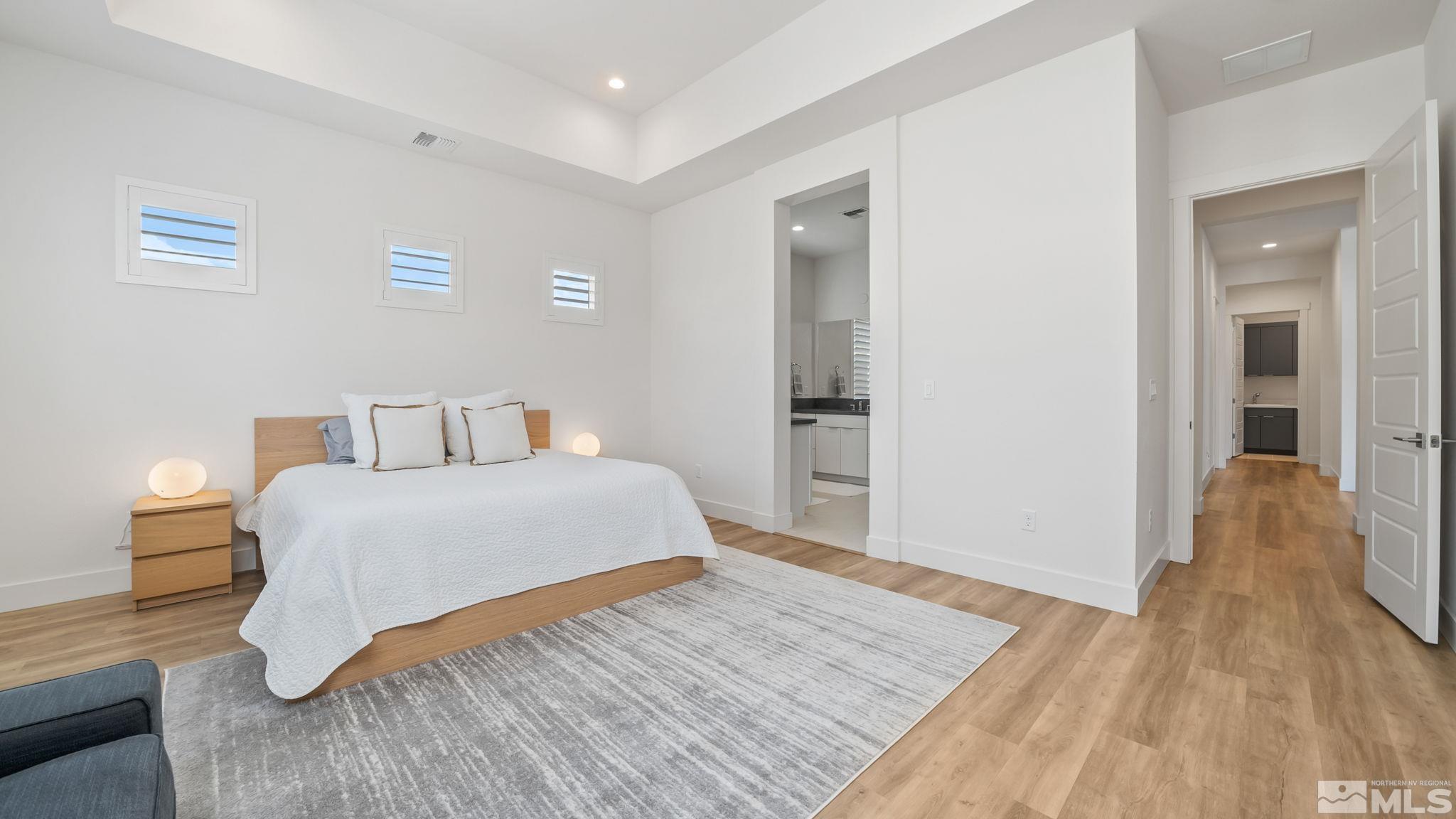13550 Water Willow Street Reno, NV 89521 - Photo 20 of 37 a bedroom with a bed and wooden floor