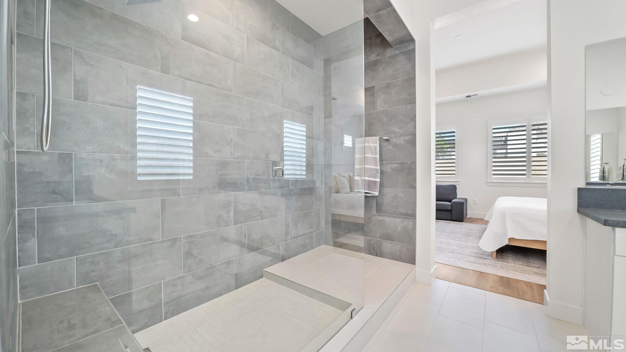 13550 Water Willow Street Reno, NV 89521 - Photo 24 of 37 a en suite bathroom with a bathtub and shower