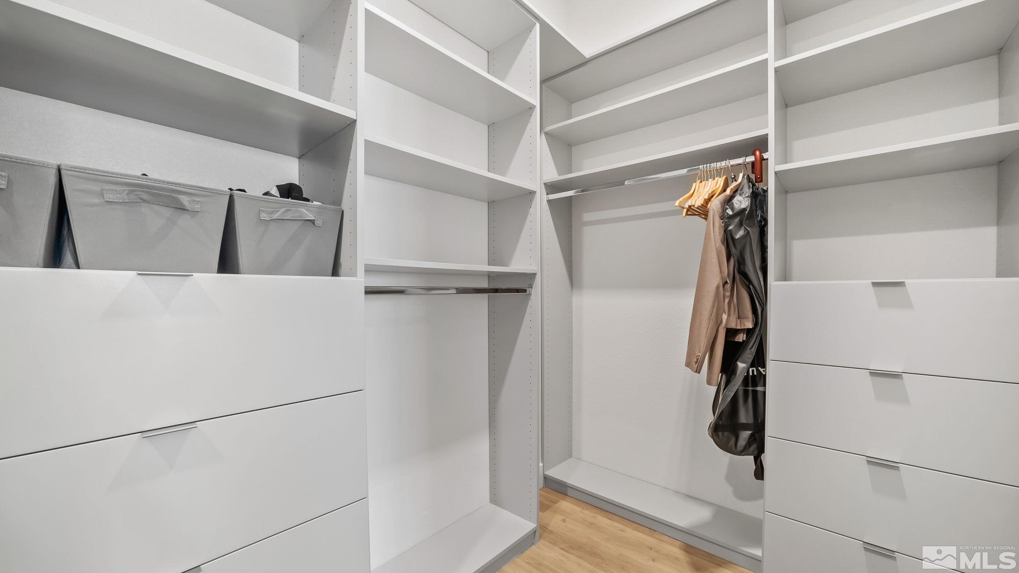 13550 Water Willow Street Reno, NV 89521 - Photo 25 of 37 a view of walk in closet with clothes and shower