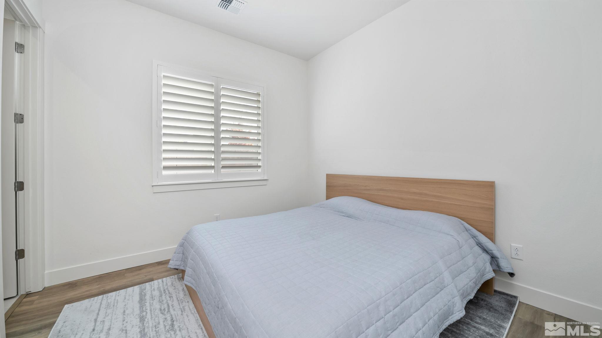 13550 Water Willow Street Reno, NV 89521 - Photo 26 of 37 a bedroom with a bed and a window