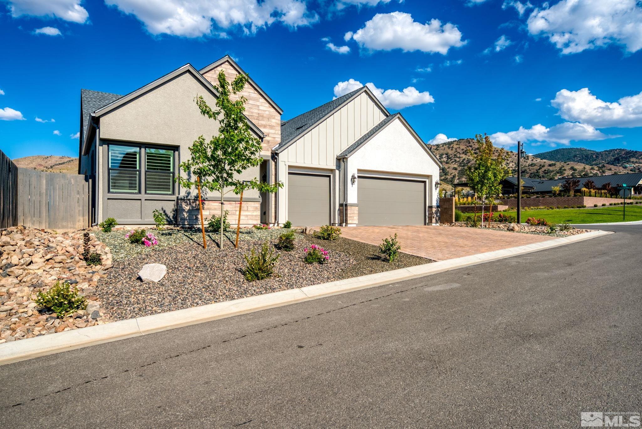 13550 Water Willow Street Reno, NV 89521 - Photo 33 of 37 a view of a house with a yard and potted plants