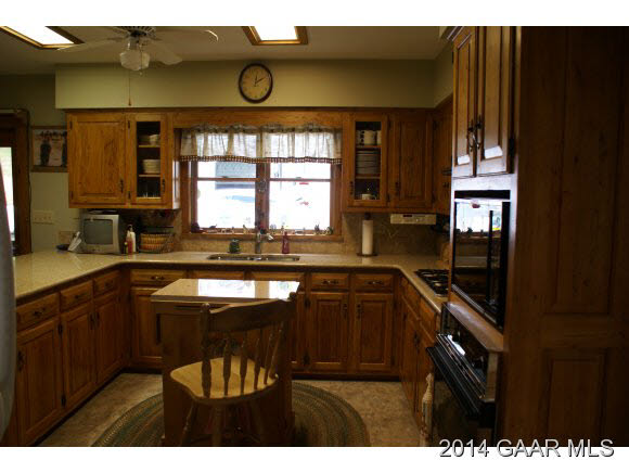 2679 Shutterlee Mill Road Staunton, VA 24401 - Photo 14 of 34 a kitchen with a sink cabinets and window