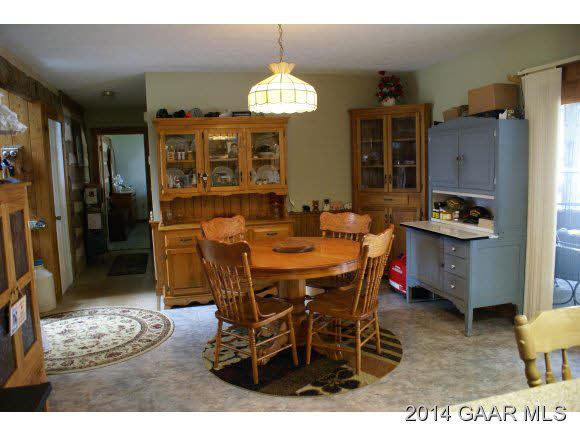 2679 Shutterlee Mill Road Staunton, VA 24401 - Photo 16 of 34 a dining room with furniture a chandelier and window