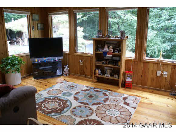 2679 Shutterlee Mill Road Staunton, VA 24401 - Photo 18 of 34 a living room with a flat screen tv and a floor to ceiling window