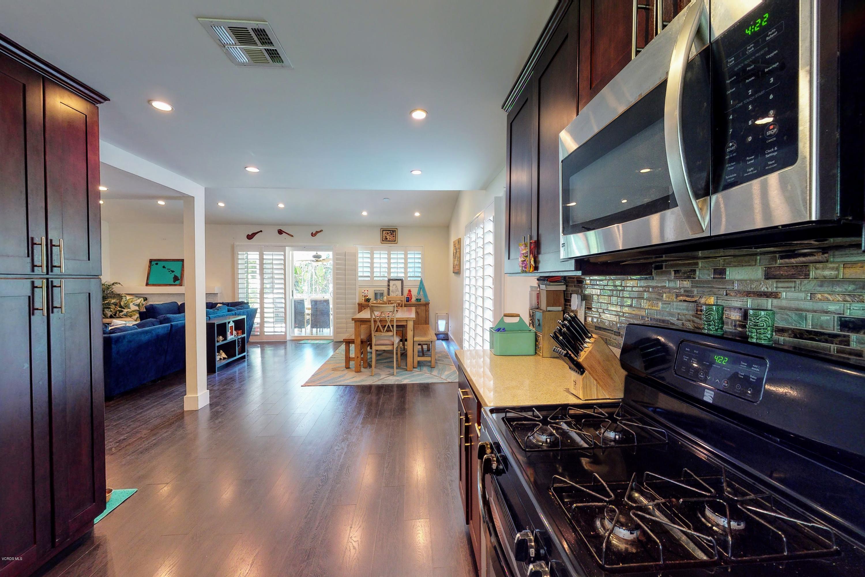 2298 Copley Street Simi Valley, CA 93063 - Photo 11 of 51 a kitchen with stainless steel appliances granite countertop a stove and cabinets