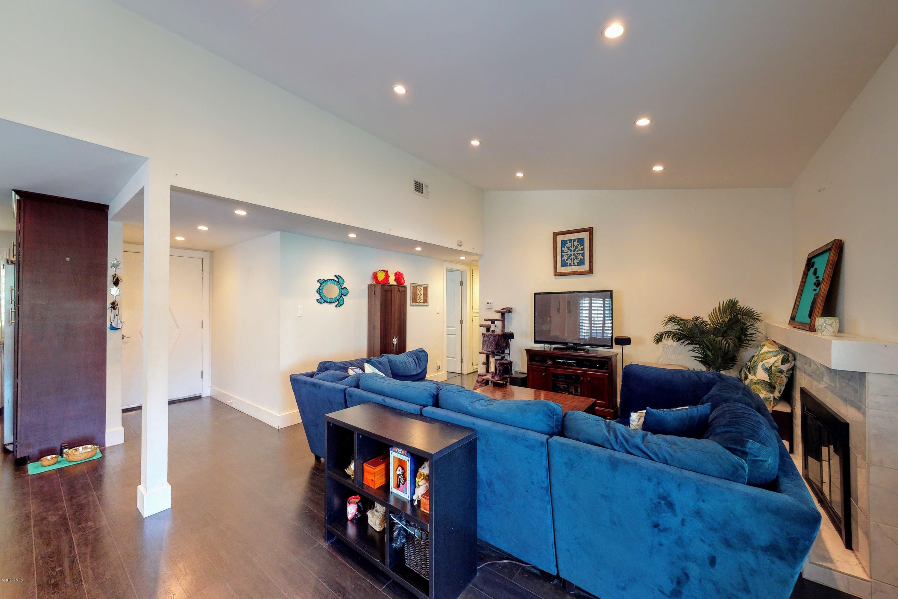 2298 Copley Street Simi Valley, CA 93063 - Photo 15 of 51 a living room with furniture and a flat screen tv