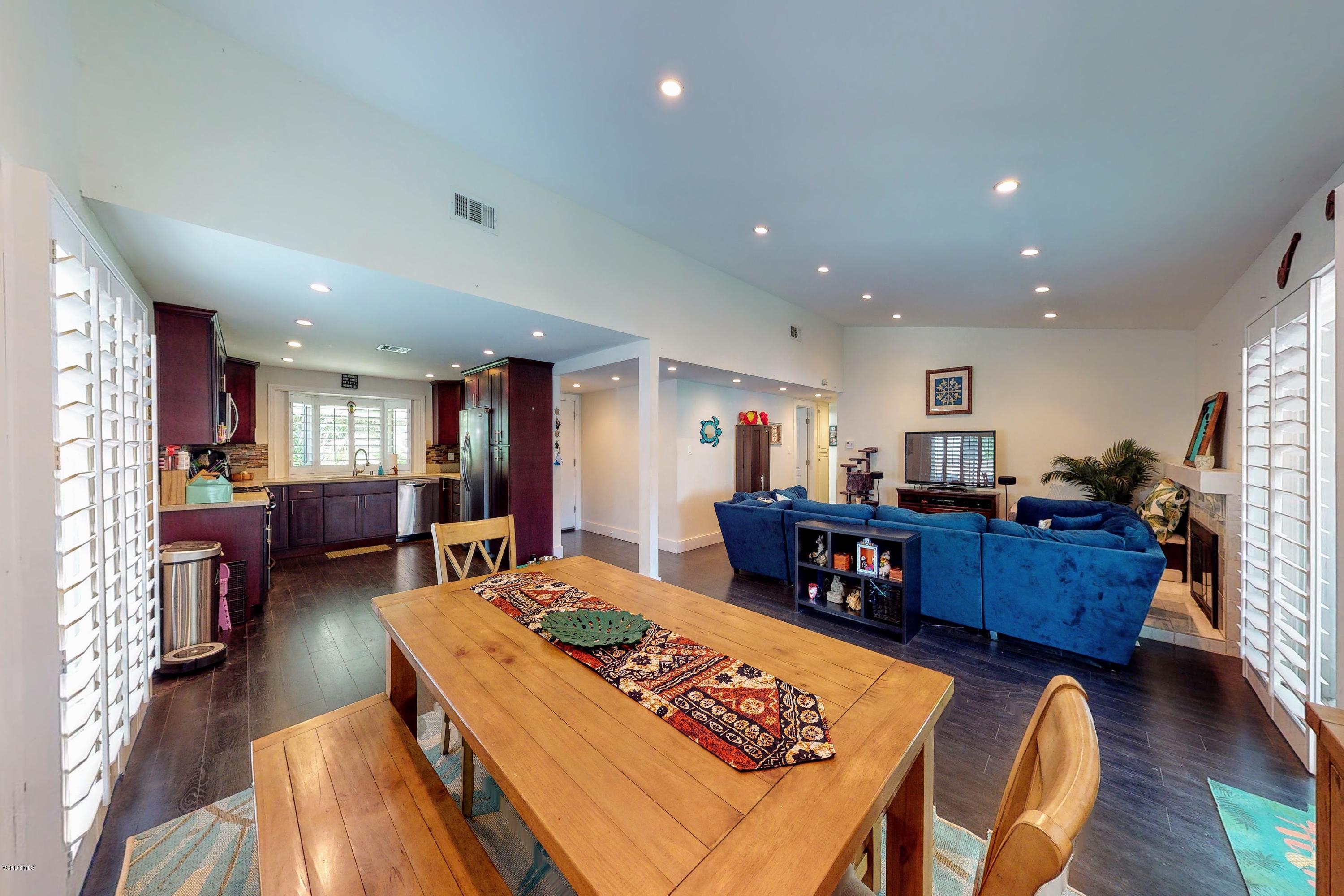 2298 Copley Street Simi Valley, CA 93063 - Photo 17 of 51 a living room with furniture and a dining table with wooden floor