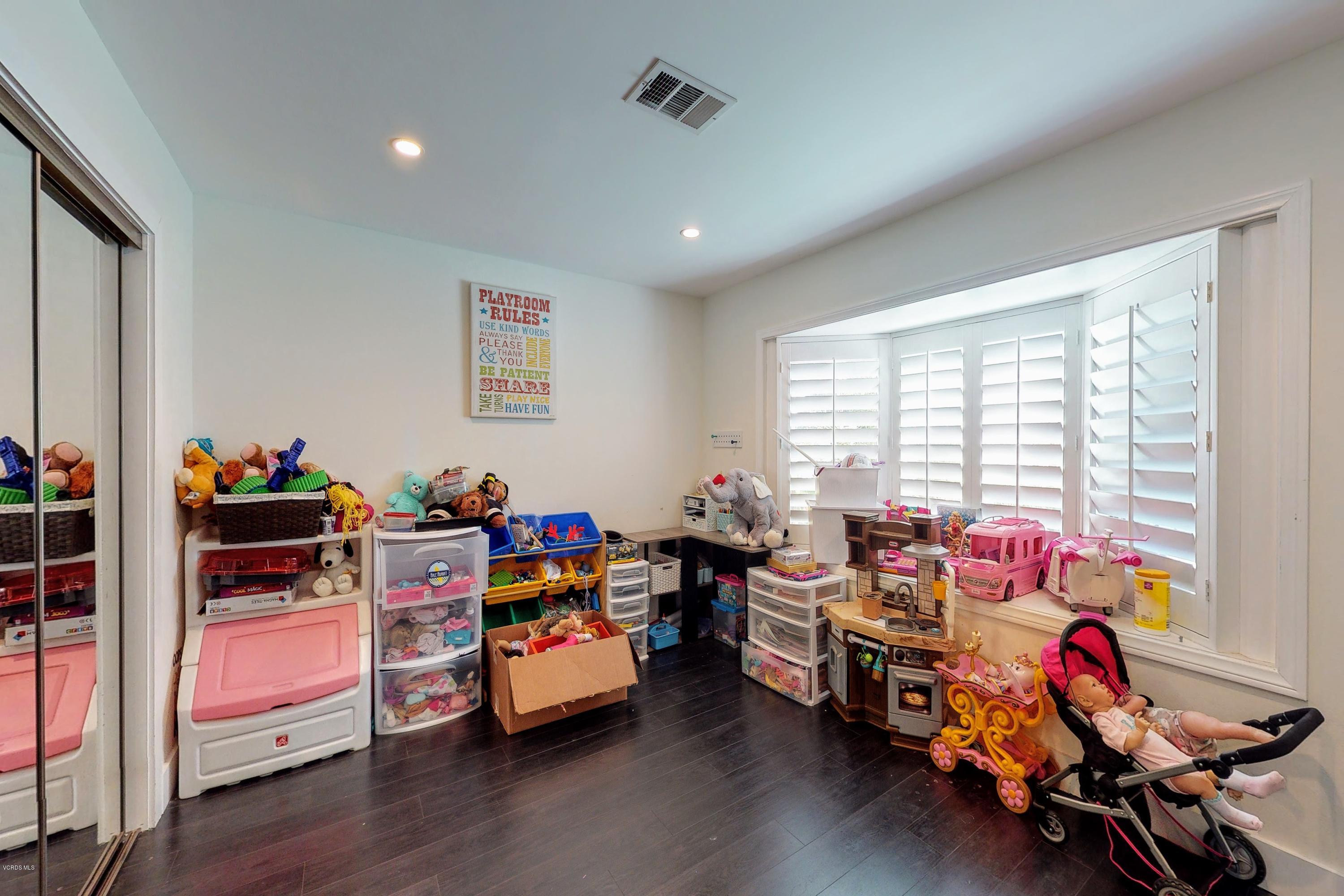 2298 Copley Street Simi Valley, CA 93063 - Photo 20 of 51 a living room with furniture and a wooden floor