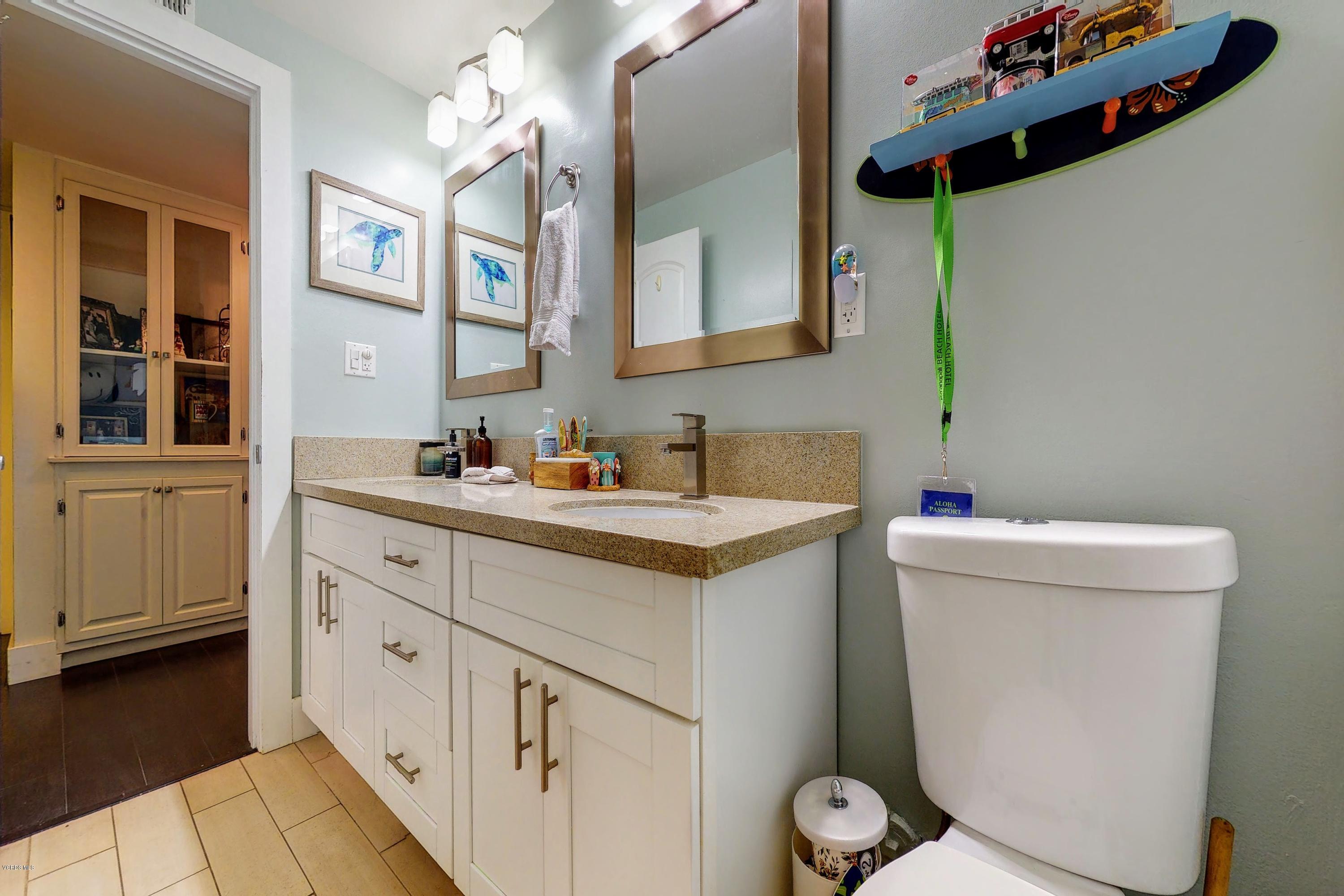 2298 Copley Street Simi Valley, CA 93063 - Photo 24 of 51 a bathroom with a toilet sink and mirror