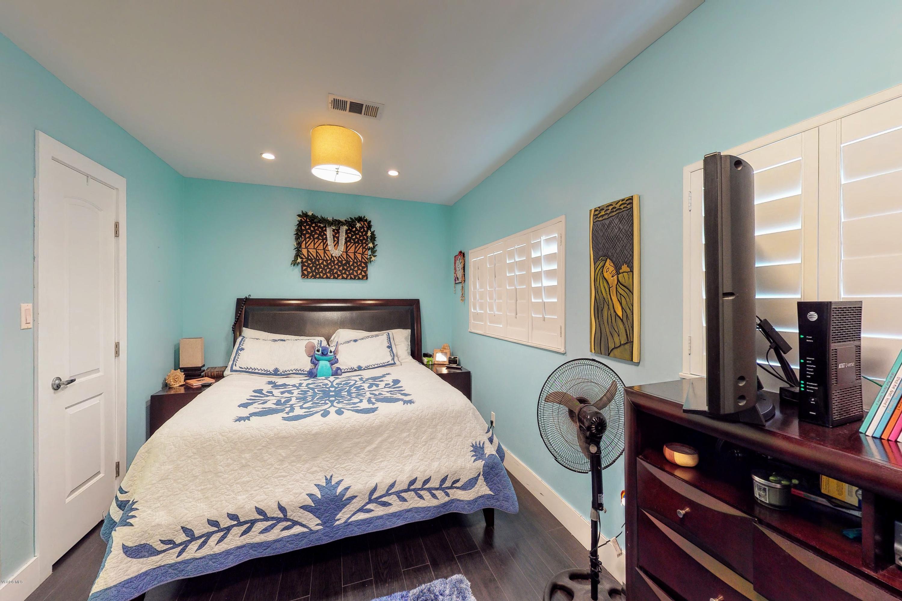 2298 Copley Street Simi Valley, CA 93063 - Photo 32 of 51 a bedroom with a bed and a flat tv screen on dresser