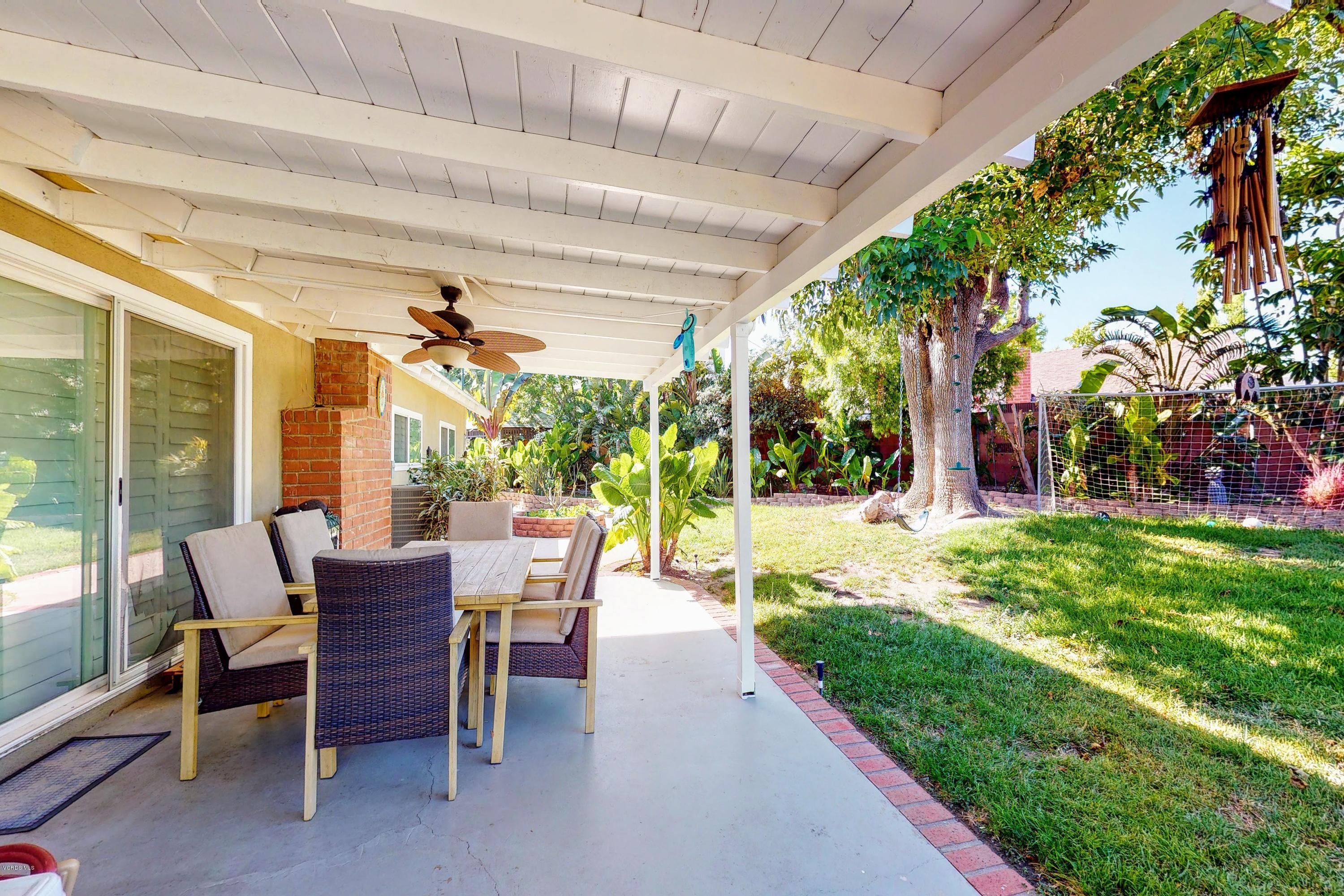 2298 Copley Street Simi Valley, CA 93063 - Photo 36 of 51 a view of a patio with a table chairs and a backyard