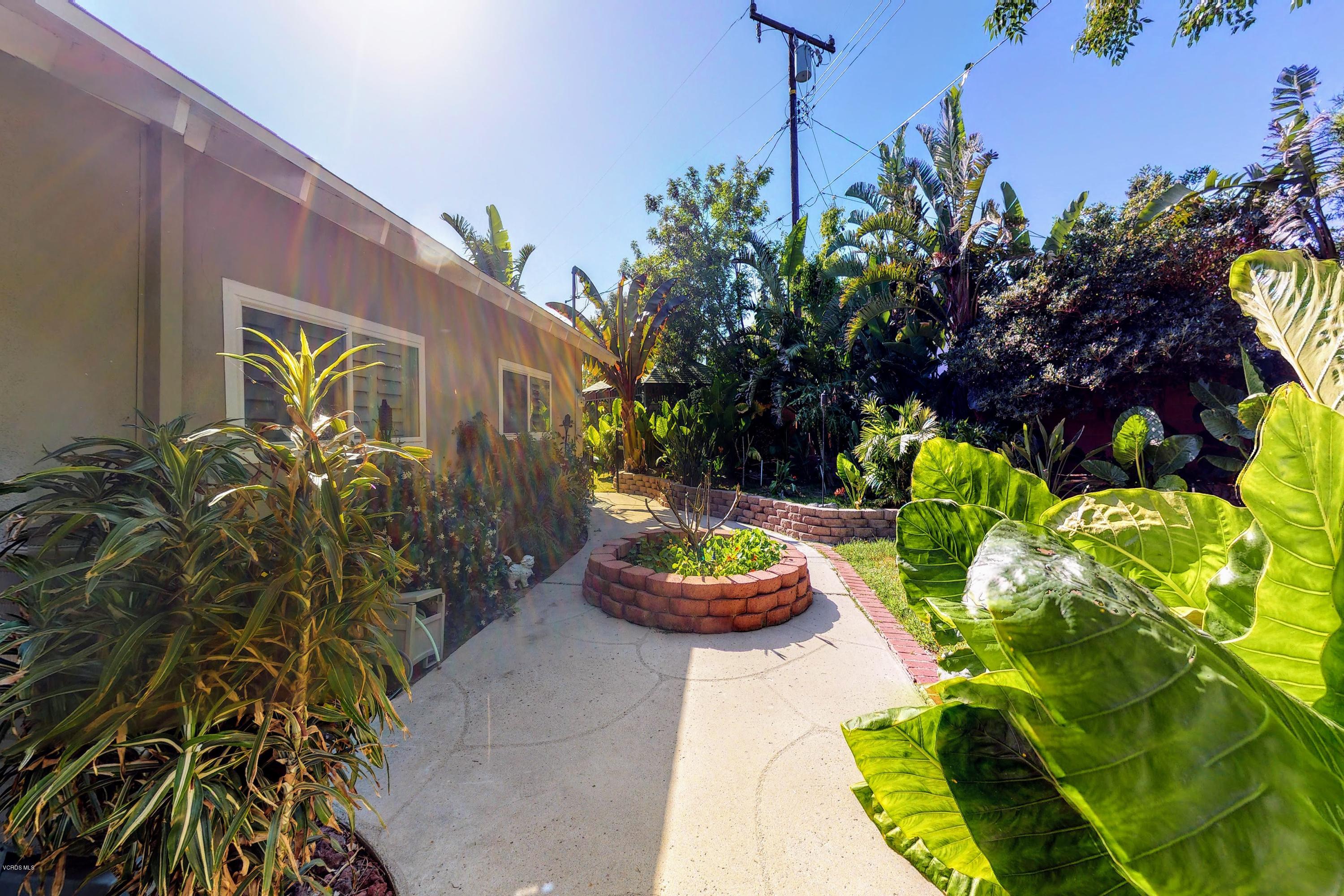 2298 Copley Street Simi Valley, CA 93063 - Photo 38 of 51 a front view of a house with a yard and a garden