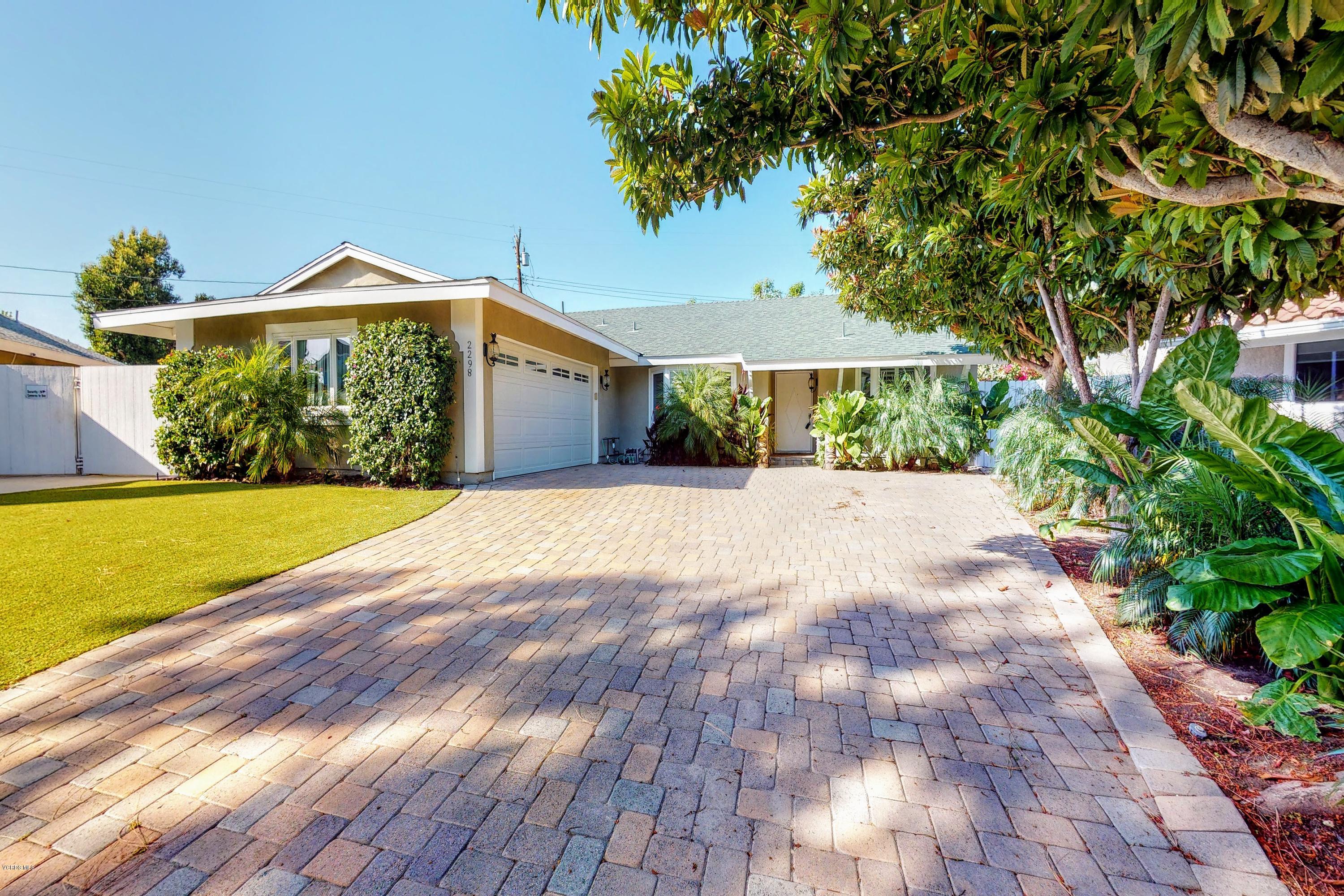 2298 Copley Street Simi Valley, CA 93063 - Photo 47 of 51 a view of a house with a yard and potted plants