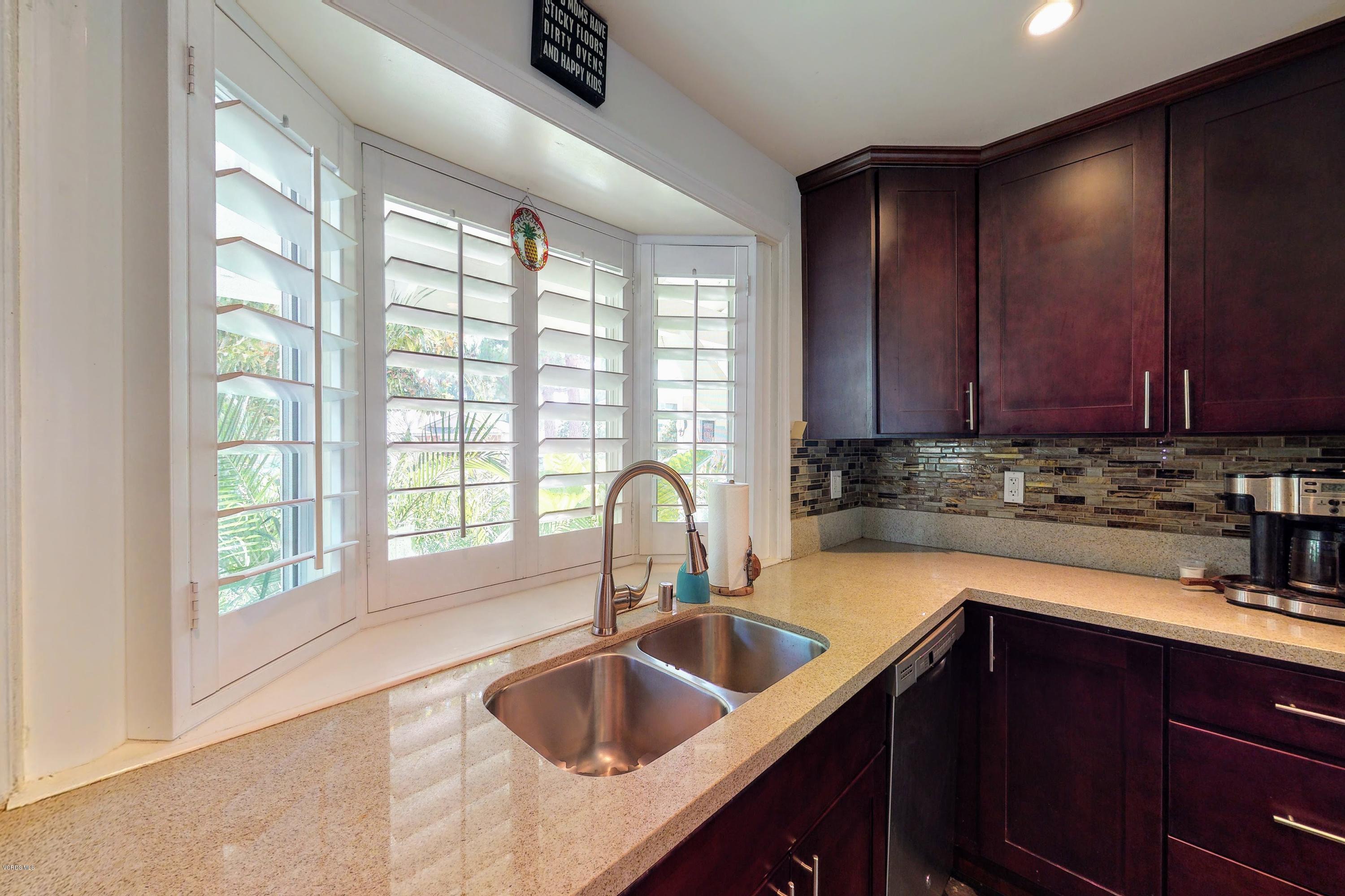 2298 Copley Street Simi Valley, CA 93063 - Photo 10 of 51 a kitchen with a sink cabinets a window and appliances