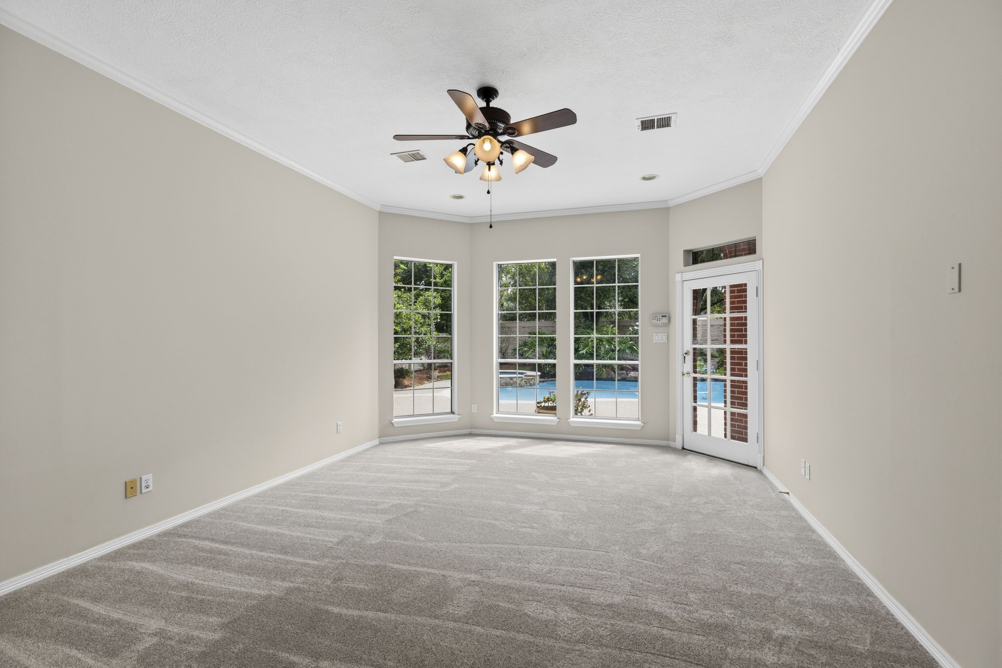 18310 Pamela Way Spring, TX 77379 - Photo 20 of 42 Fresh new paint adorns the downstairs and primary suite. Easy access to the pool and hot tub from the primary suite.