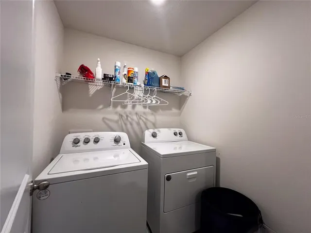 a utility room with dryer and washer