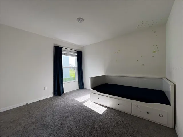 a view of an empty room and window