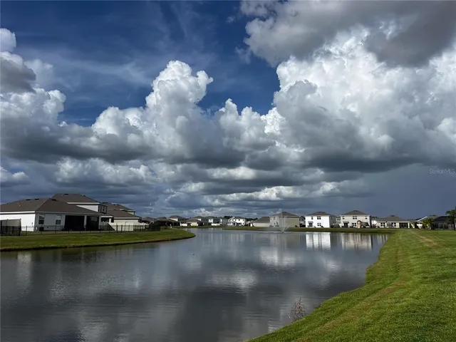 a view of a lake in middle of a city