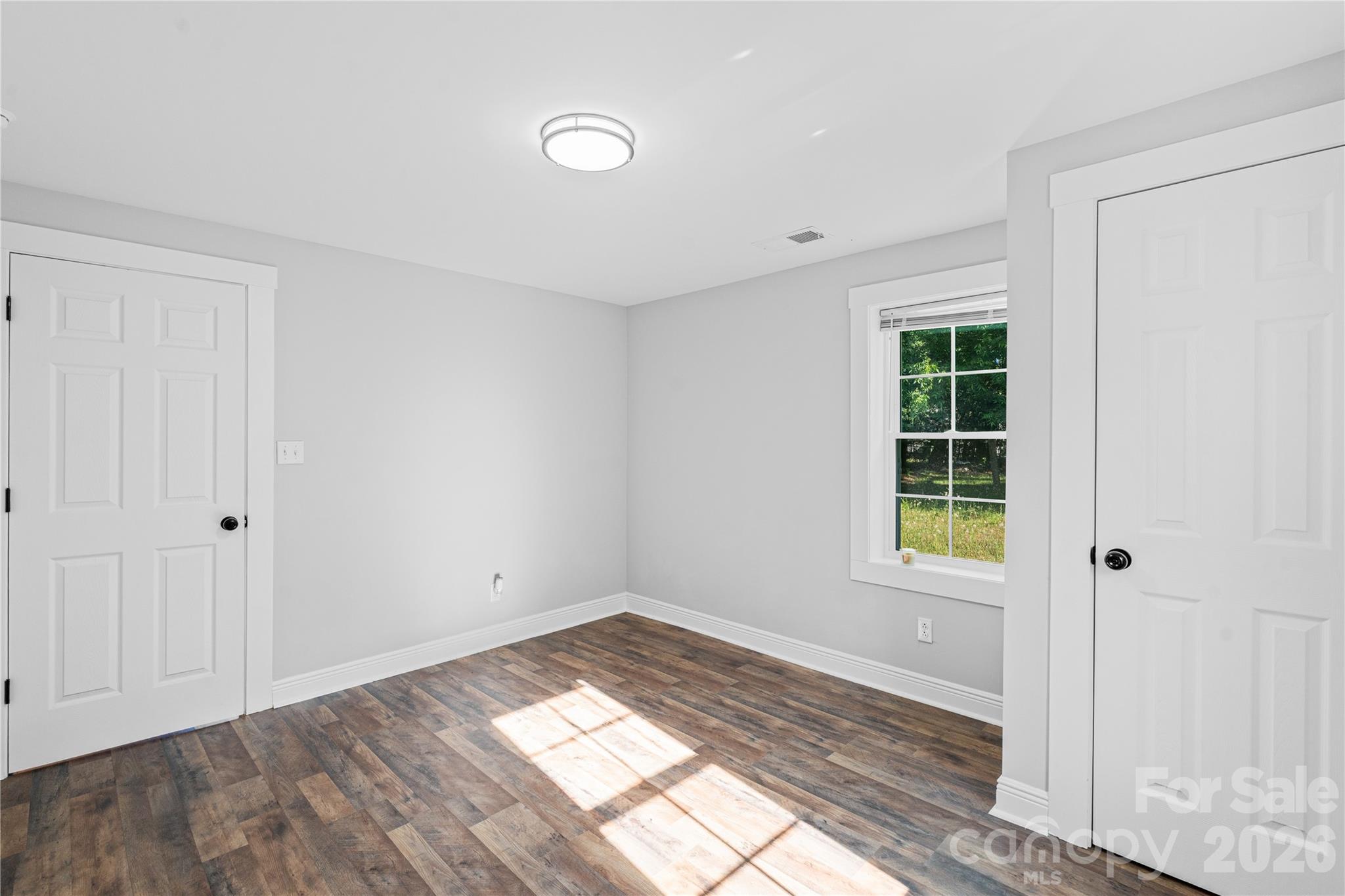 906 Gladstone Street Florence, SC 29501 - Photo 12 of 15 a view of empty room with wooden floor and fan