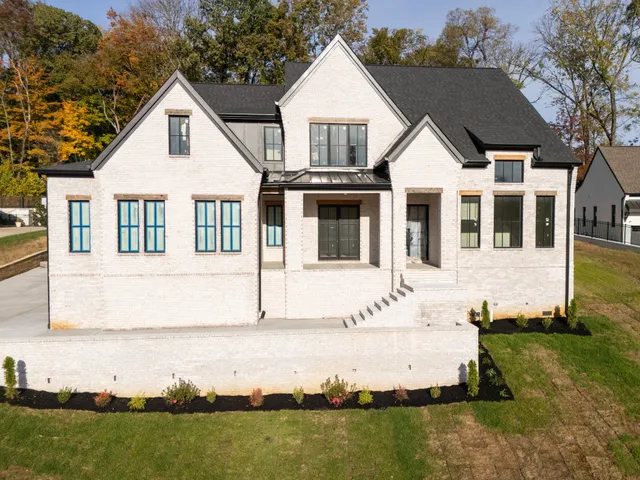 a view of house with yard