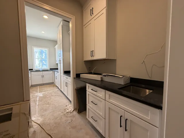 a view of a hallway with stairs