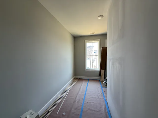 a black and white photo of a living room