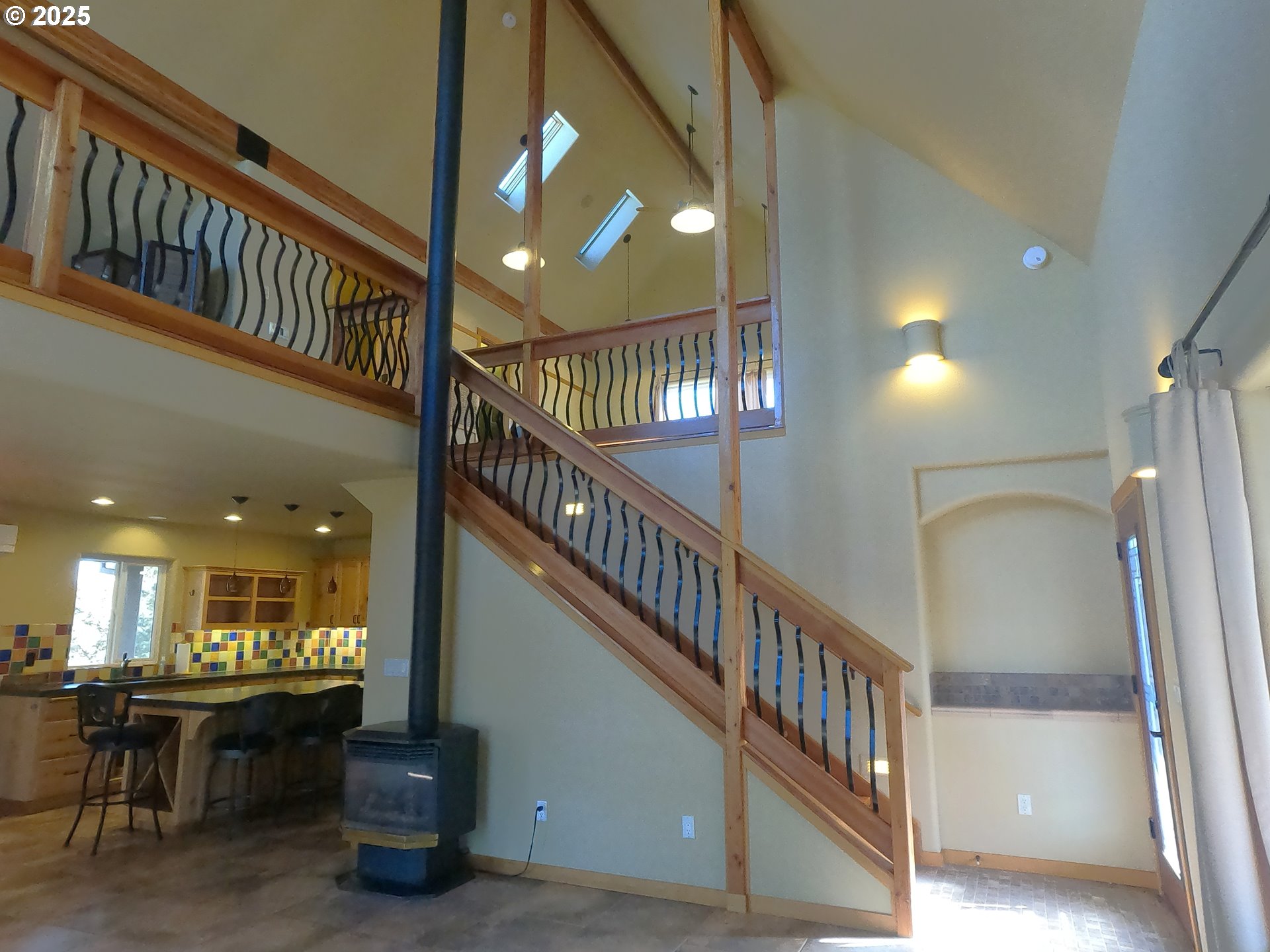 5215 Southwest Upper Canyon Rim Drive Culver, OR 97734 - Photo 11 of 24 a view of staircase and a kitchen with furniture and stairs