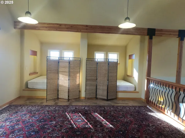 a view of a room with furniture and a window