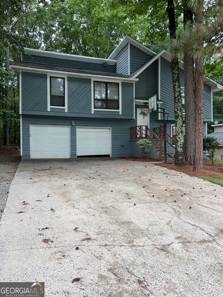 1265 Herrington Road Lawrenceville, GA 30044 - Photo 1 of 52 a front view of a house with a yard