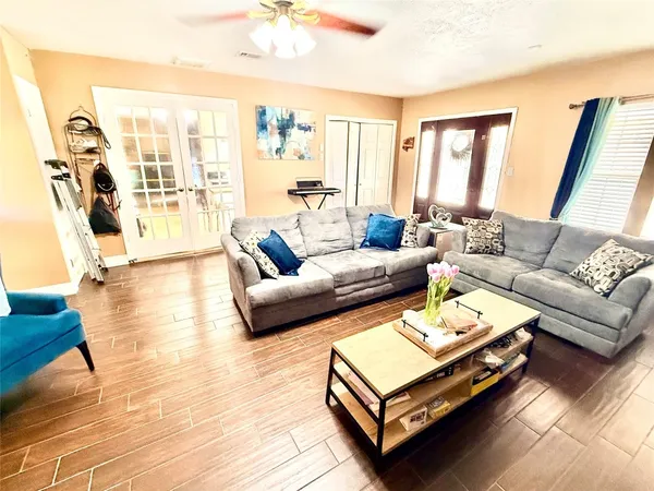a living room with furniture and a large window