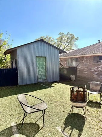 a backyard of a house with seating space