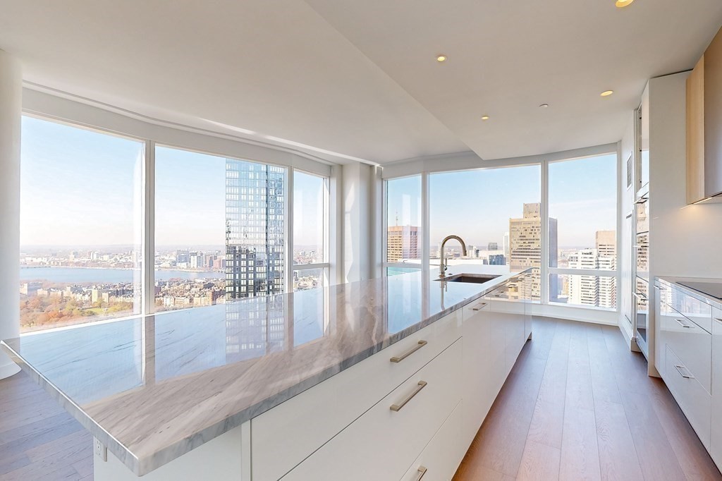240 Devonshire Street, Unit 3901 Boston, MA 02110 - Photo 6 of 40 a large white kitchen with a large window