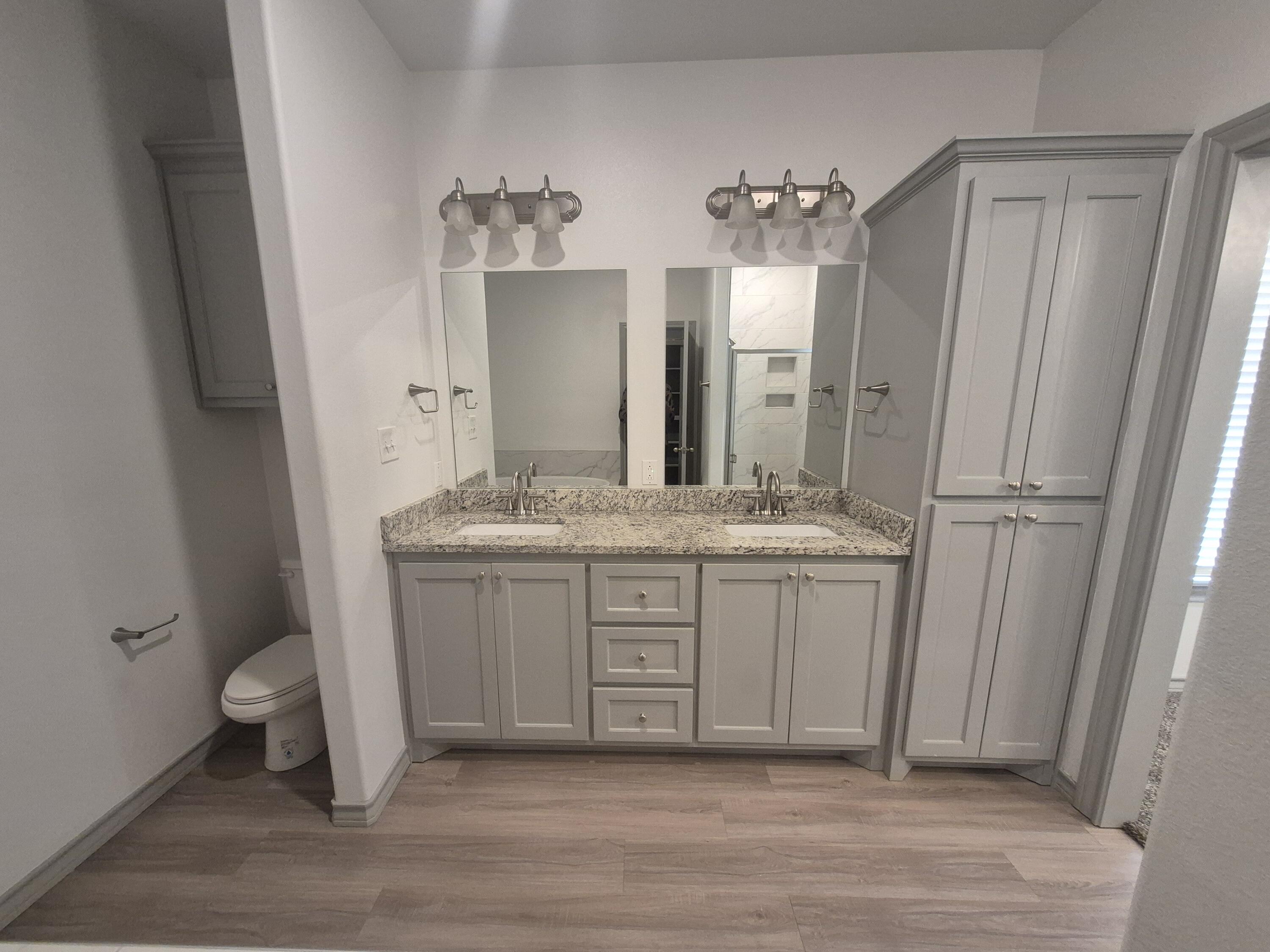4718 125th Street Lubbock, TX 79424 - Photo 16 of 18 a bathroom with a double vanity sink and mirror
