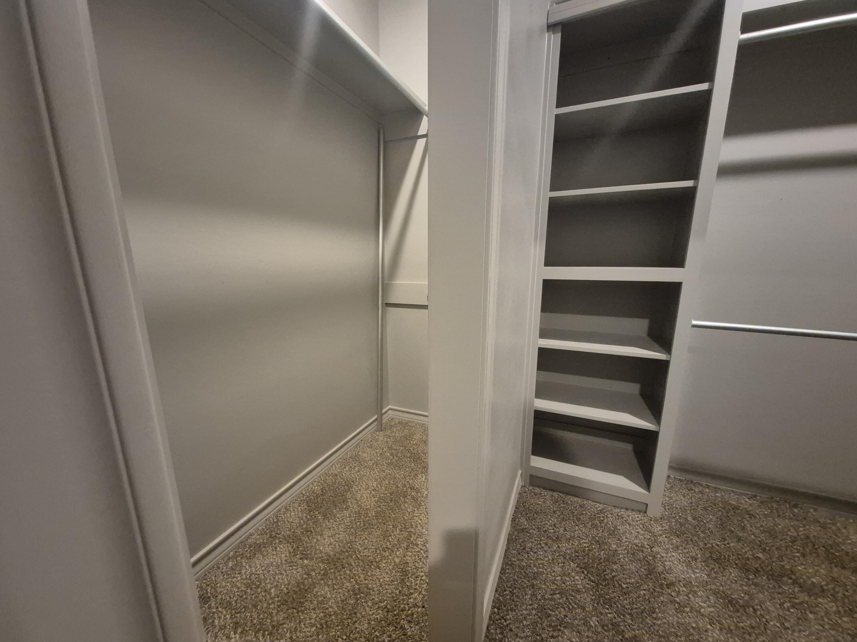 4718 125th Street Lubbock, TX 79424 - Photo 18 of 18 a view of walk in closet with empty racks