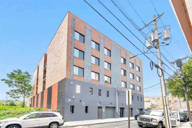 a view of a building with a street