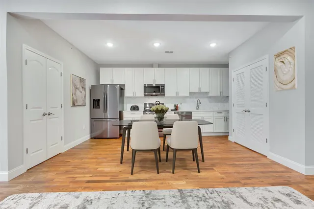 a view of kitchen with refrigerator stove and microwave