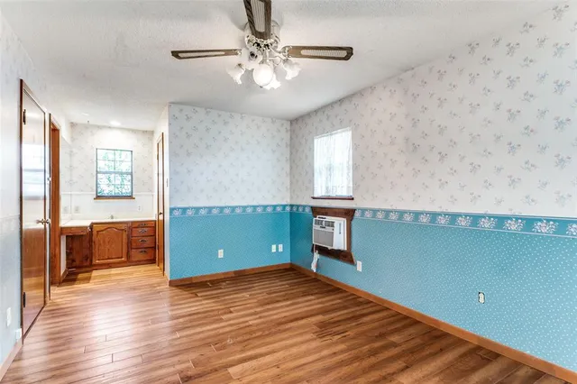 a bathroom with a sink vanity toilet and a shower