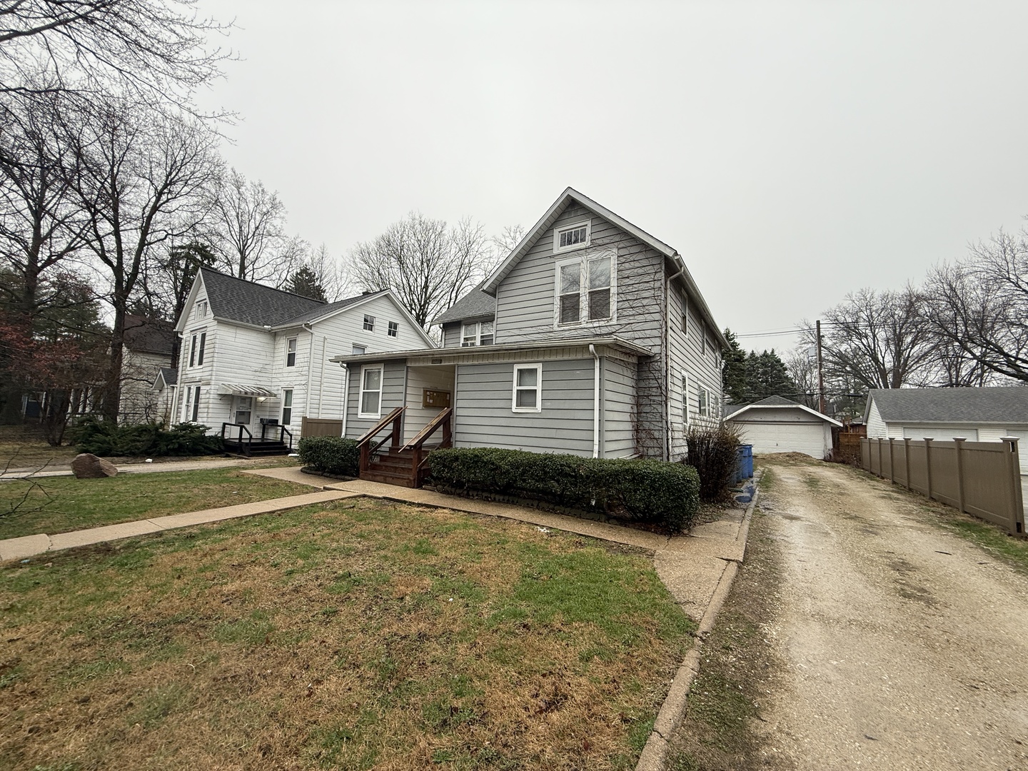 1013 West Church Street Champaign, IL 61821 - Photo 2 of 14 a front view of a house with a yard
