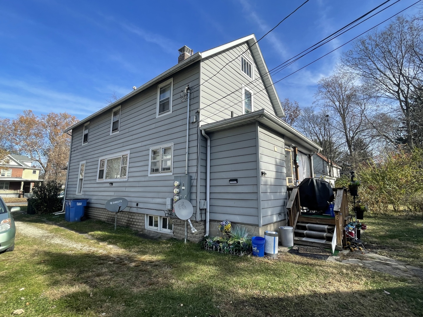 1013 West Church Street Champaign, IL 61821 - Photo 4 of 14 a backyard of a house with barbeque oven and a table
