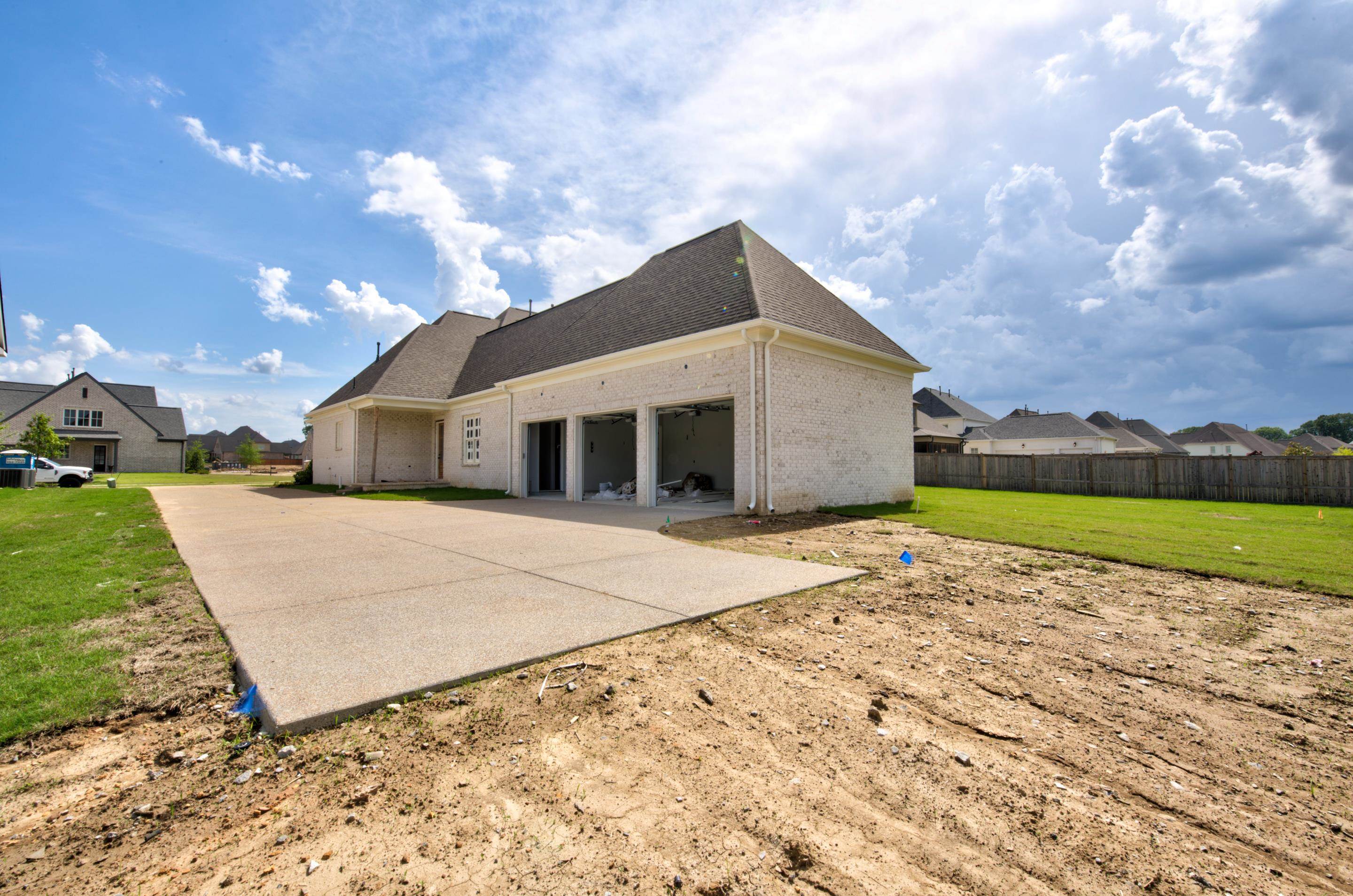 1244 Percheron Pass Collierville, TN 38017 - Photo 4 of 18 a front view of a house with a yard and garage