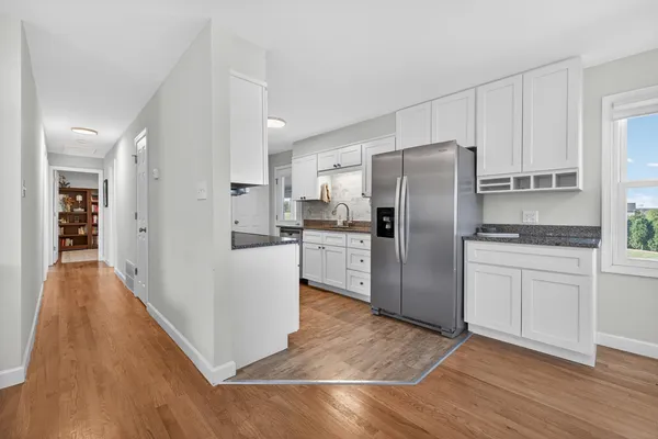 a bedroom with furniture and a book shelf