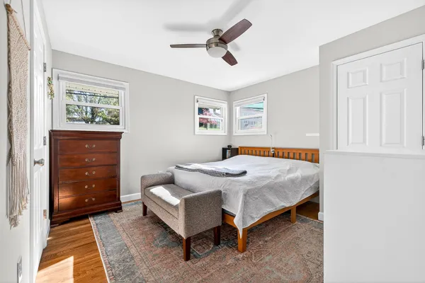 a view of a workspace with furniture and wooden floor