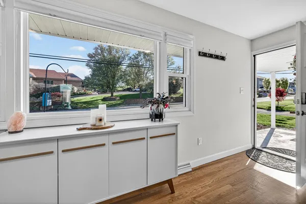 a kitchen with a sink and a large window